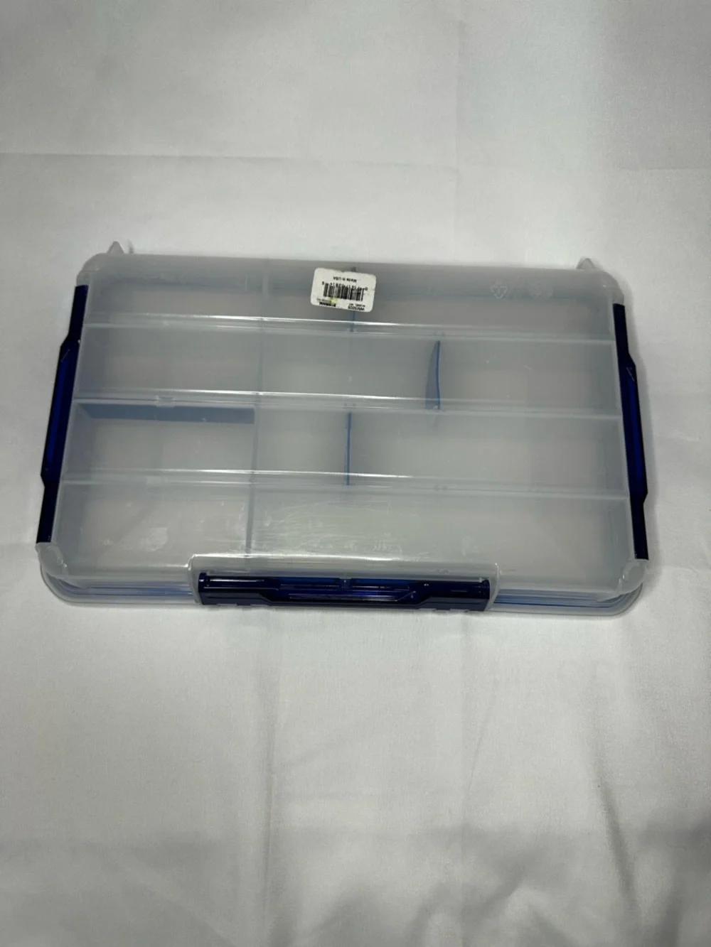 Multi-Compartment Clear Plastic Storage Box with Blue Accents.